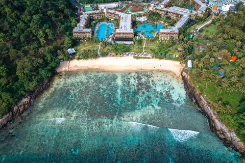 Aerial view of Freedom Beach in Phuket with white sand and crystal-clear water