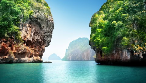 Limestone cliffs rising above turquoise water at Railay Beach in Krabi, Thailand