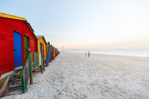 Colorful beach huts lining Muizenberg Beach in Cape Town, South Africa