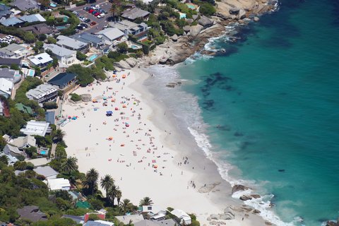 Aerial view of Clifton Beach with turquoise water and granite boulders in Cape Town