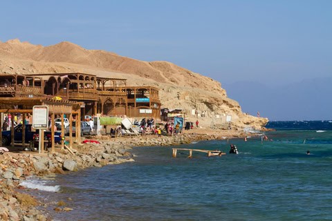 Rocky shoreline at the Blue Hole in Dahab, Egypt, a world-famous diving destination